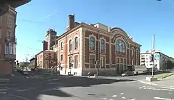 Red brick Russian building with white stone cornering