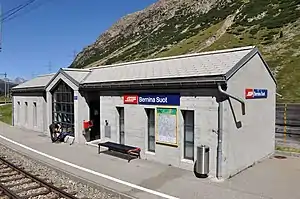 Single-story concrete building with gabled roof