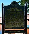 A photo of the Michigan Historical Marker placed on the bridge