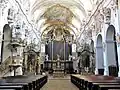 Central nave of the church and apse with high altar and two side altars