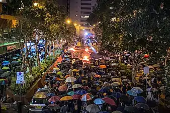 Protesters trying to break police cordon in Tsim Sha Tsui to get near the campus