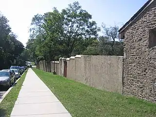 A view looking south along 20th street at the retaining wall.