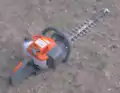 A gasoline-powered hedge trimmer