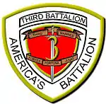 A white shield with a red interior and a gold border. On the top is written "Third Battalion" and on the bottom written "America's Battalion". The red interior has a "3" in the center with a sword running through it with the words "Third Marines" on the top and "Fortes Fortuna Juvat" on the bottom.