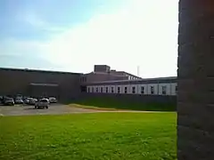 A view of the science wing and single gym from the back of the school.