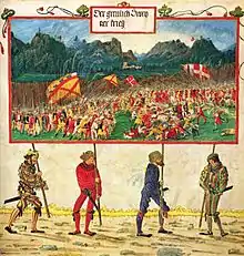 A miniature painting showing four brightly clothed men carrying a large banner which is painted with a complex battle scene