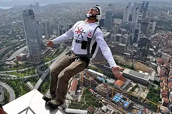 Image 16BASE jumpingPhotograph credit: Kontizas DimitriosBASE jumping is the recreational sport of jumping from fixed objects, using a parachute to descend safely to the ground. The acronym stands for four categories of fixed objects from which the jumps can be made: buildings, antennae, spans, and earth (cliffs). In this photograph, a BASE jumper launches himself from the top of the Sapphire Tower in Istanbul, Turkey.More selected pictures