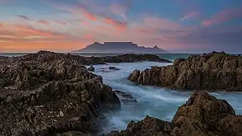 As seen from the other side of Table Bay at sunset.