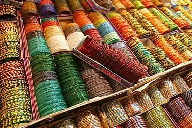 Image 4BanglesPhotograph: Muhammad Mahdi KarimBangles on display in Bangalore, India. These rigid bracelets are usually made from metal, wood, or plastic and are traditionally   worn by women in India, Nepal, Pakistan, and Bangladesh. In India, it is a common tradition to see a new bride wearing glass bangles at her wedding and the honeymoon will end when the last bangle breaks.More selected pictures