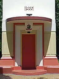 Clock tower doorway with Hastings Borough Council coat of arms and the date 1935