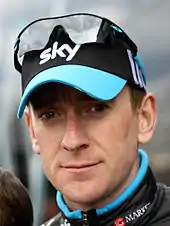 Bradley Wiggins wearing a black cap with the word "SKY" written on it