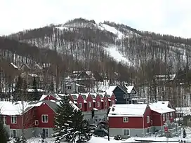 Mont Brome behind houses of the municipality of Bromont