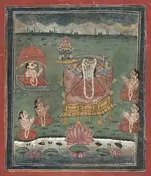 Depicted enthroned, a decapitated, dark-complexioned woman wearing a red/orange sari holds a sword in her left hand and her own severed head  (with a lotus crown) on a platter in her right hand. Five seated devotees (including one with a ram's head) with folded hands surround her. A lake with a large lotus is in the foreground.