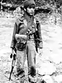 An Iranian child soldier holding an AKM in the Iran–Iraq War.