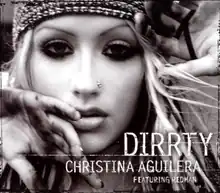 Picture with the words "DIRRTY CHRISTINA AGUILERA FEATURING REDMAN" under the image of Christina Aguilera's face. She has a nose earring, a tight fitting cap, and mascara-darkened eyes. Her hands are partially blocking the view of her face.