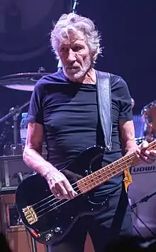 Roger Waters playing bass guitar