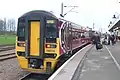 A Class 158 operated by East Midlands Trains stands at Ely station on a Norwich to Liverpool service