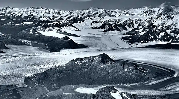 Great Nunatak in lower half of frame surrounded by Columbia Glacier in 1966