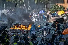 Protesters throwing molotov cocktails at the police