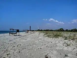 Another beach with two lighthouses in the background, old and new (2012)