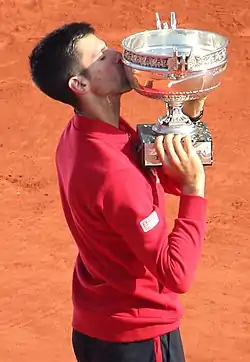 Image 43Novak Djokovic, the 2023 men's singles champion. It was his record-breaking twenty-third major title and his third at the French Open. (from French Open)