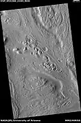 Row of mounds, as seen by HiRISE under HiWish program  Arrows point to some of the mounds.