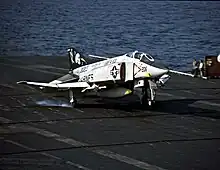 A VMFA-531 F-4N landing on the USS Coral Sea in 1980