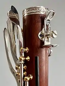 Adjustable support on a basset clarinet