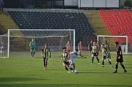 Fatih Karagümrük (white) in the home match against Fenerbahçe (navy/yellow) of the 2021-22 Turkish Women's Football Super League play-offs.