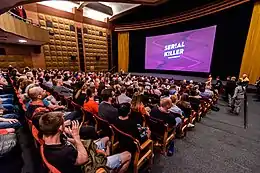 spectators sitting in a cinema during a screening of a series at Serial Killer festival