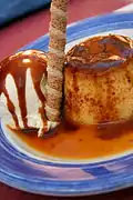 Flan con helado, a Spanish dessert with a barquillo