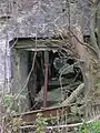 The remains of the waterwheel inside the mill extension