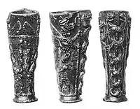 The "Libation vase of Gudea" with the dragon Mušḫuššu, dedicated to Ningishzida (21st century BC short chronology). The caduceus (right) is interpreted as depicting god Ningishzida. Inscription; "To the god Ningiszida, his god, Gudea, Ensi (governor) of Lagash, for the prolongation of his life, has dedicated this"