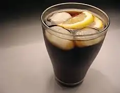 Image 31A glass of cola served with ice cubes and lemon (from List of drinks)