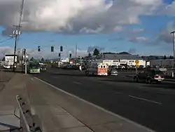 An EmX bus approaches a station in Glenwood, along Franklin Boulevard.