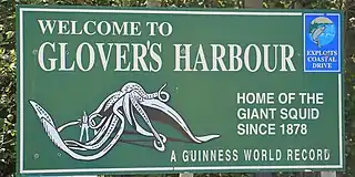 Welcome sign referencing the giant squid specimen of 1878 and its recognition by Guinness World Records