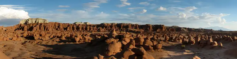 hundreds of sandstone hoodoos protruding from the desert floor.