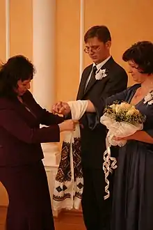 Civil wedding ceremony in Ukraine. The cloth is a ceremonial rushnyk decorated with traditional Ukrainian embroidery.