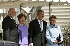 Norwegian King Harald V and Norwegian Queen Sonja, greeted by First Lady of the United States U.S. President George W. Bush and his wife, Laura Bush at the White House during a state visit in Washington, D.C., United States, in March 2005.