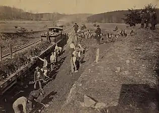 The locomotive, "General Haupt" is being used for work detail. Standing on the bank is USMRR Supt for the O & A railroad, John Henry Devereux. He and his "boss" Herman Haupt are often confused. Devereux is slightly more portly than the very slim Haupt. Haupt USUALLY wore his BG uniform. This image is of work being done on a "Y" on the O & A. Possibly close to Devereux Station in 1863