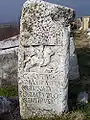 Thracian horseman with hound and serpent-entwined tree, funerary stele for one Caius Cornelius  at Philippi.