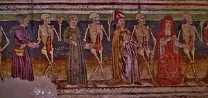 A mural depicting a cardinal, a bishop, a monk and a peasant dancing with skeletons