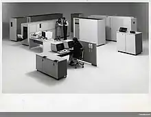 The IBM 3800 is directly behind the couple standing in the photo