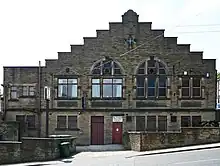 A brick entrance to the working men's club of Idle village.