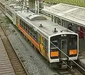 KiHa E120 and 110 at Sakamachi Station, July 2009