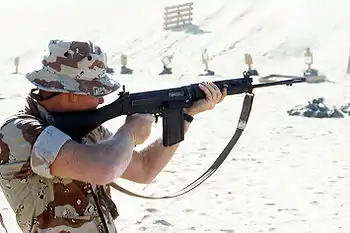 A United States Marine with a British L1A1 SLR, during a training exercise as part of the Gulf War's Operation Desert Shield.