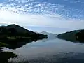 Water of Lake Hobara with clouds overhead