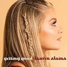 A sideways profile photo of Lauren Alaina with a braided hair strand, against a peach background. The song title and artist's name appear below her, colored in beige and red, respectively.