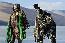 Shamans preparing themselves to perform a rite at the Blue Pearl Festival at Lake Khövsgöl, in Khövsgöl Province.