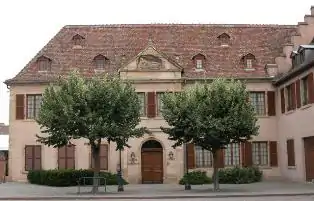 Colour photograph of a classical stone building with a pediment.